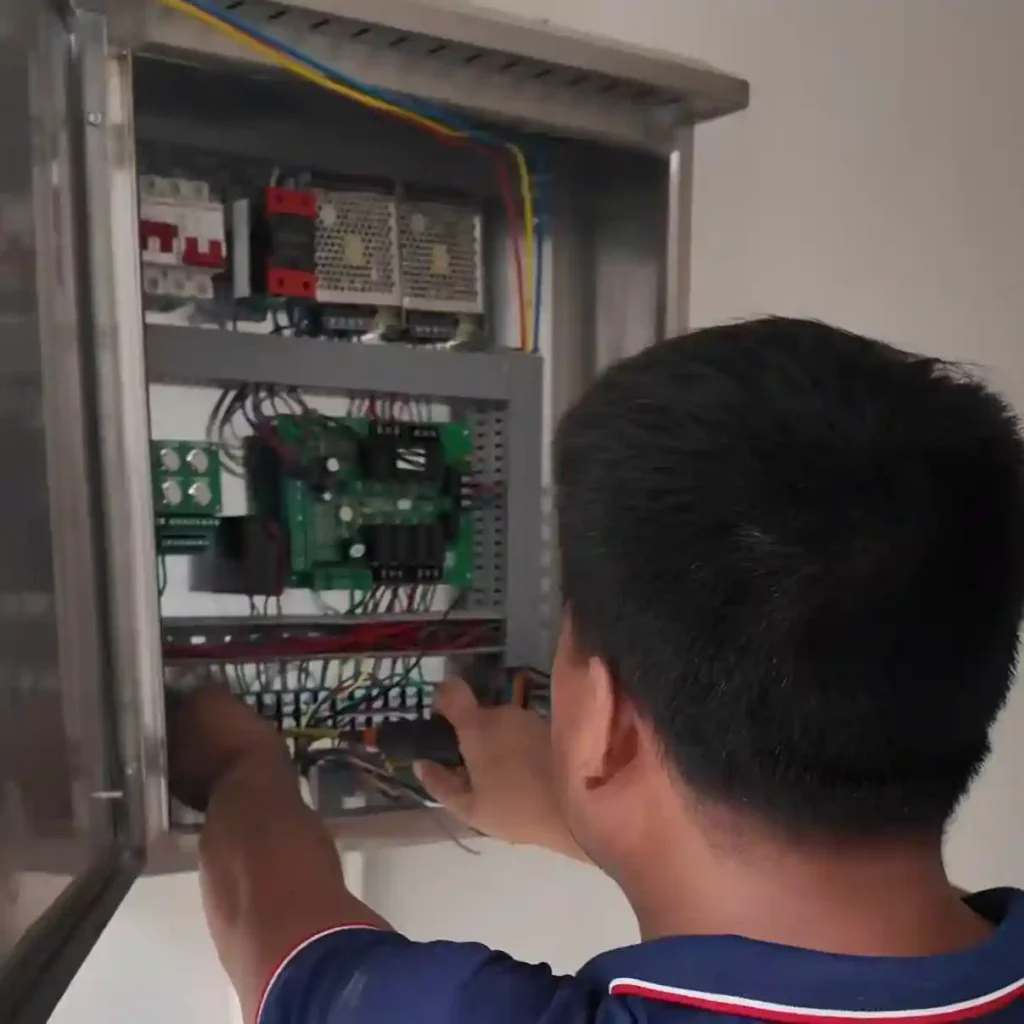 Connecting and testing the control box for an automatic bollard system