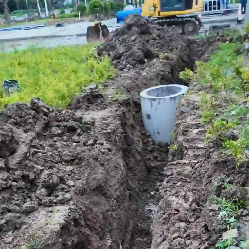 Rectangular foundation pit and drainage well prepared for automatic bollards